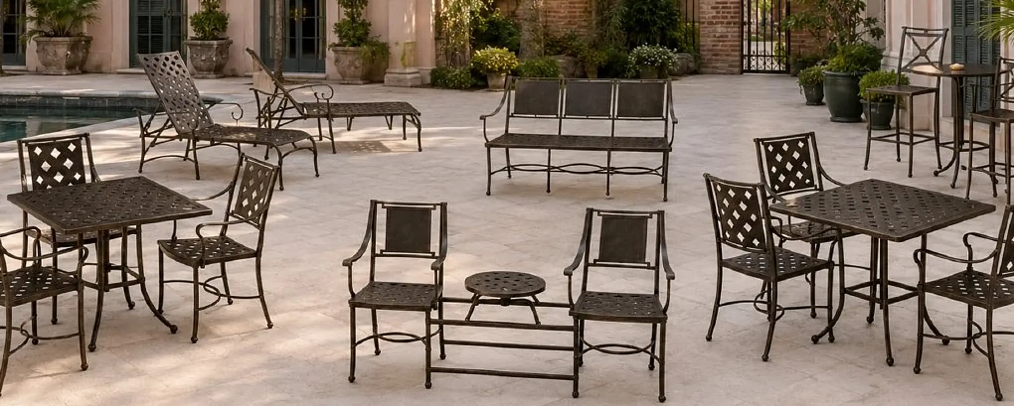 Filigrana sculptural aluminum seating arranged in a refined outdoor hospitality setting