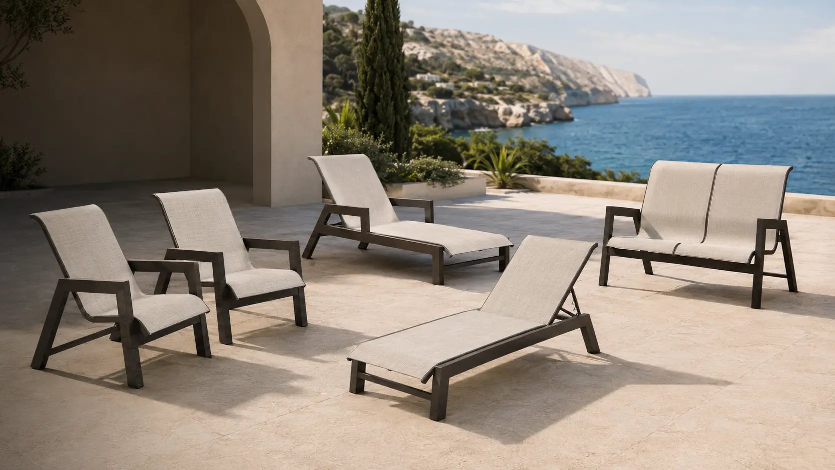 Casta dining, chaise, and loveseat seating in Bronze Age Texture and Raw Linen on a Mediterranean resort terrace