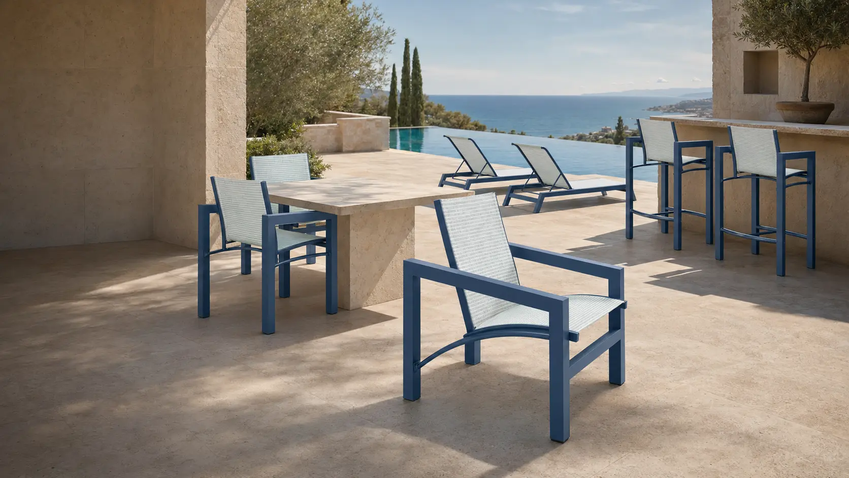 Marea Millennium dining, lounge, chaise, and bar-height seating in French Blue and Spa Stripe on a Mediterranean resort terrace