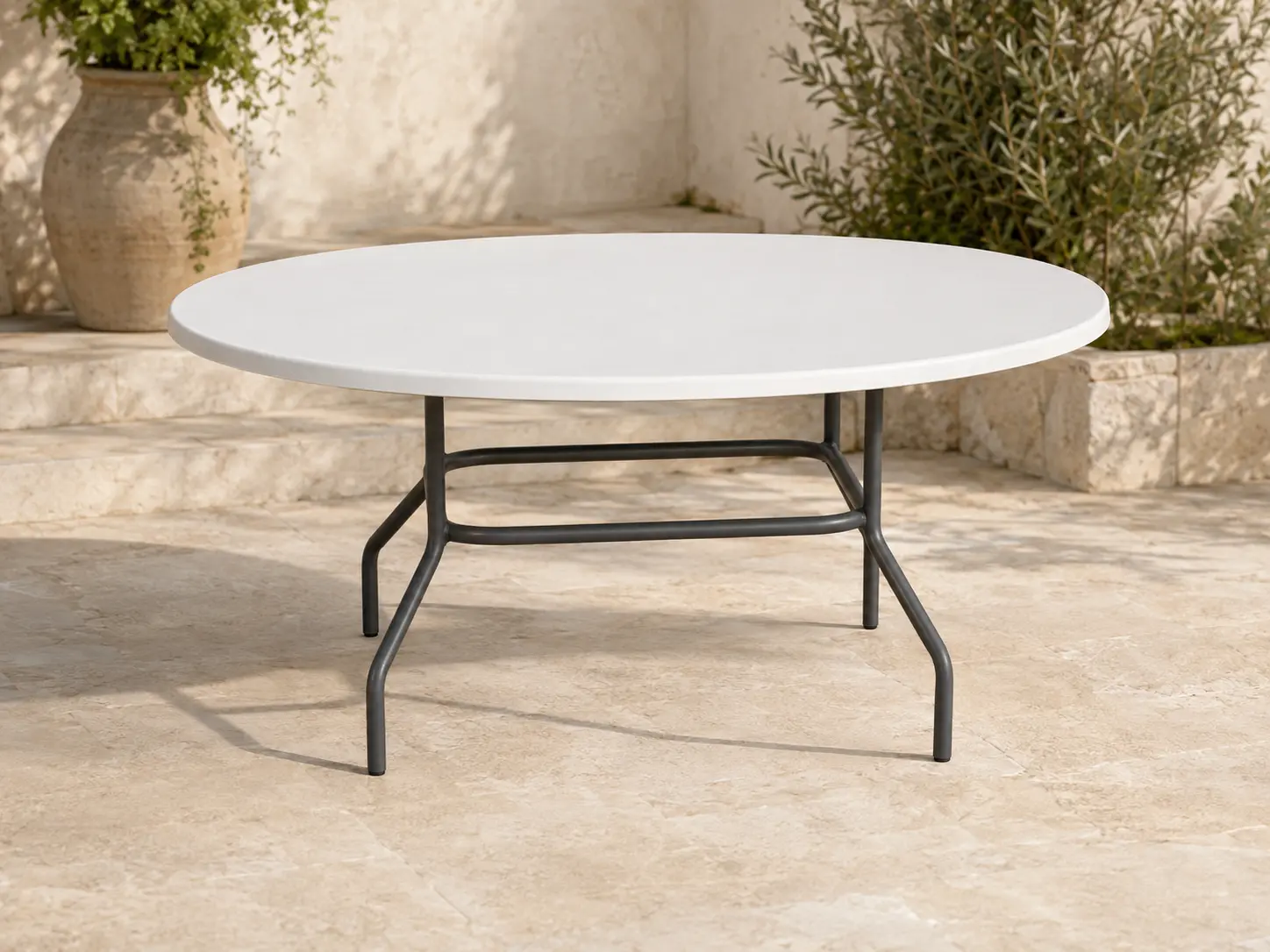 Tavola Pranzo 36 × 54 Oval Table shown in a refined outdoor setting