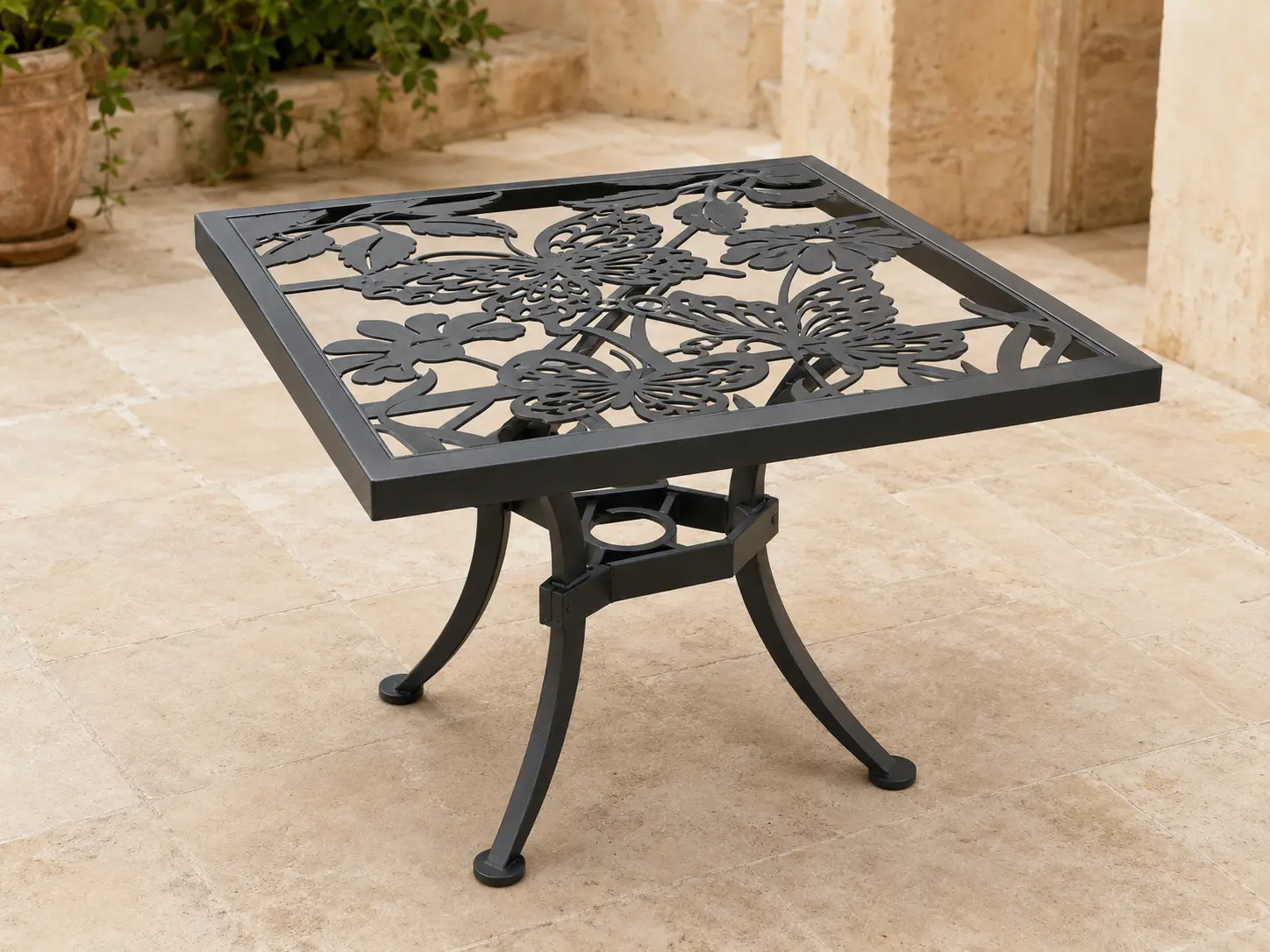 Tavola Pranzo Custom Square Table shown in a refined outdoor setting