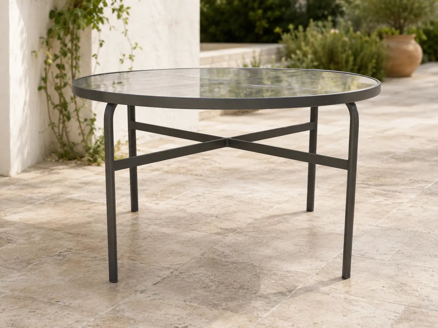 Tavola Pranzo 48 Welded Dining Table shown in a refined outdoor setting