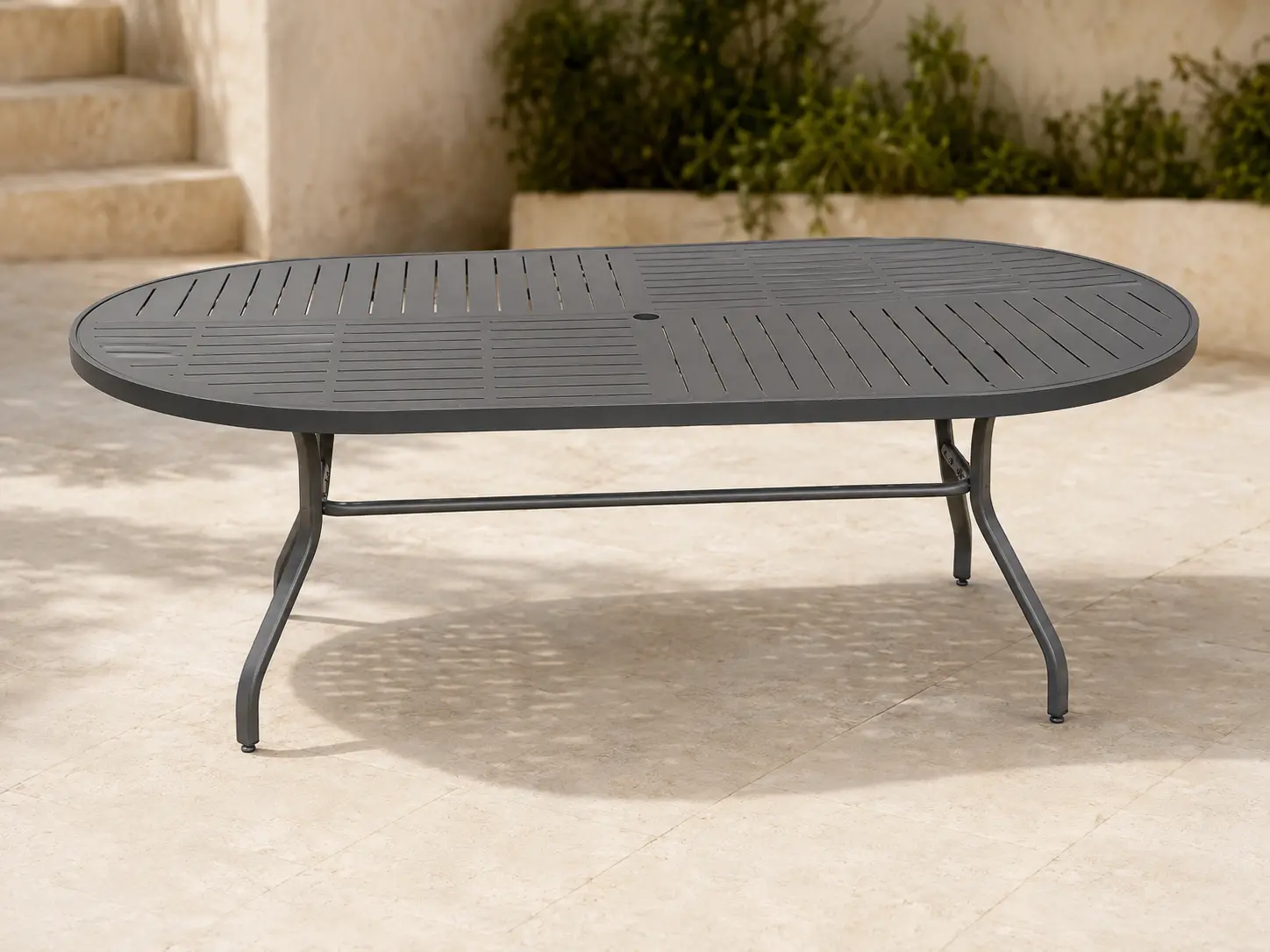 Tavola Pranzo Oval Punch Banquet Table shown in a refined outdoor setting