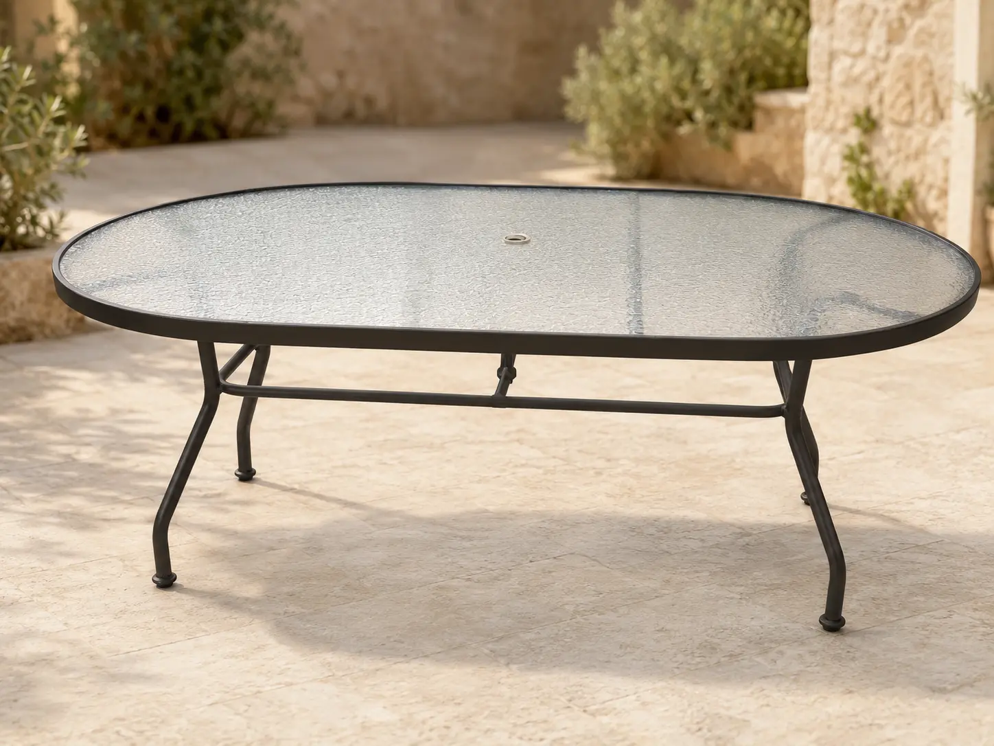 Tavola Pranzo 42 × 72 Oval Table shown in a refined outdoor setting